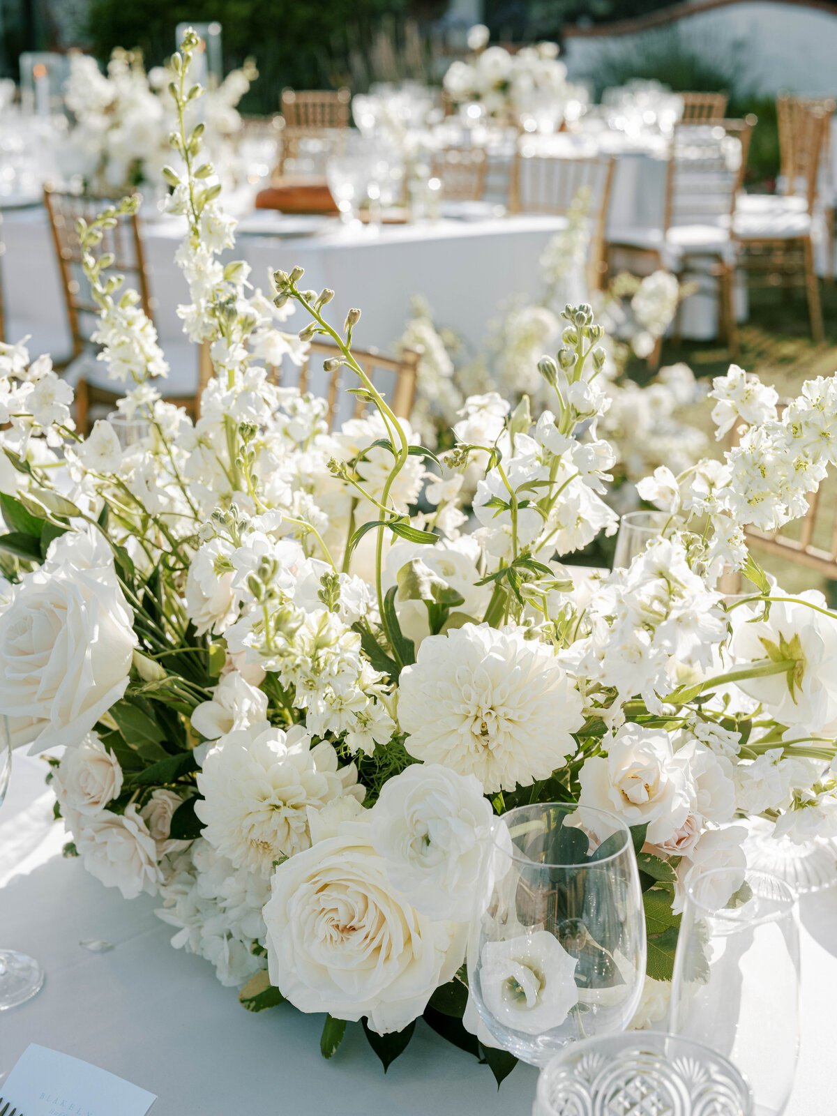 These large white flower arrangements hold the attention of guests while placed in the center of the tables.