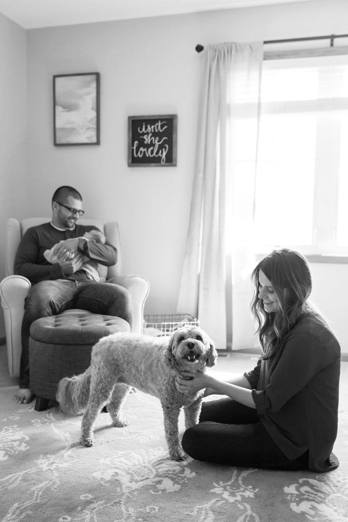 Parents in nursery with dog and baby - Naperville Lifestyle Newborn Photographer - Jen Madigan