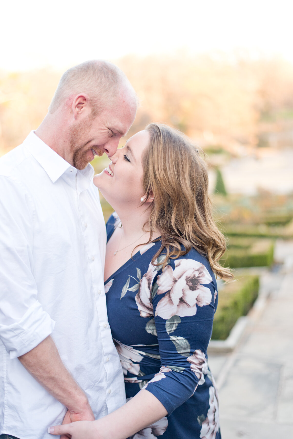 Engagement photo of man and woman touching noses in Fort Worth