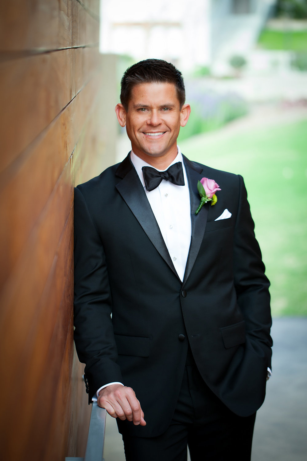 wedding photos groom smiling with nice tux