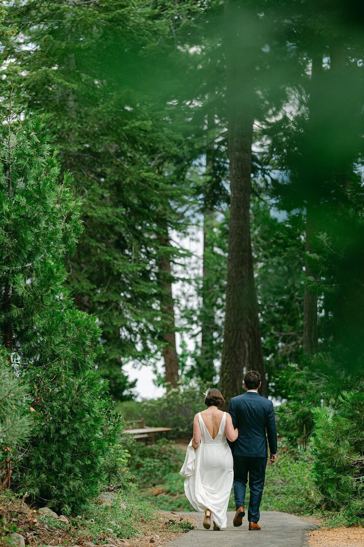 newlyweds walking from their ceremony just married inLake tahoe