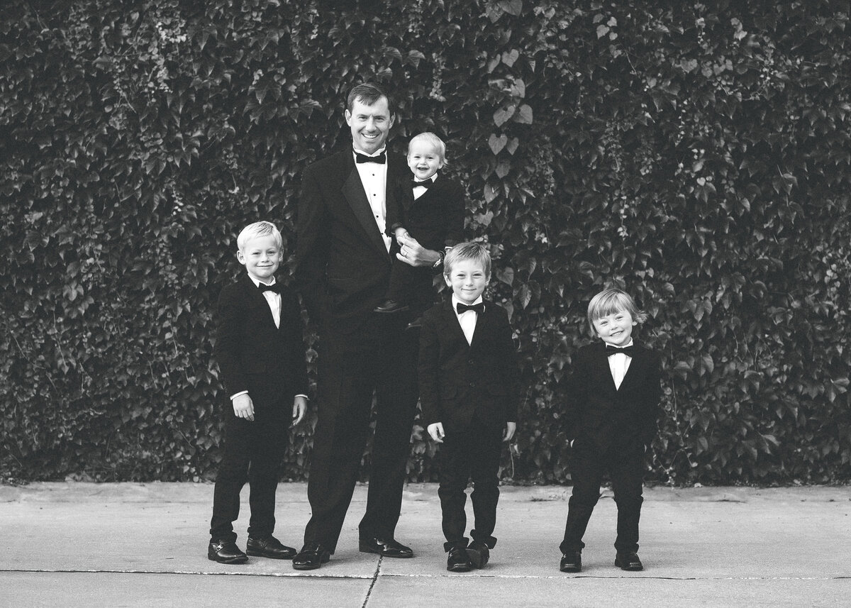 Des-Moines-Iowa-Family-Photographer-Theresa-Schumacher-Formal-Tuxedos-Mickelson-Ivy-Wall-BW