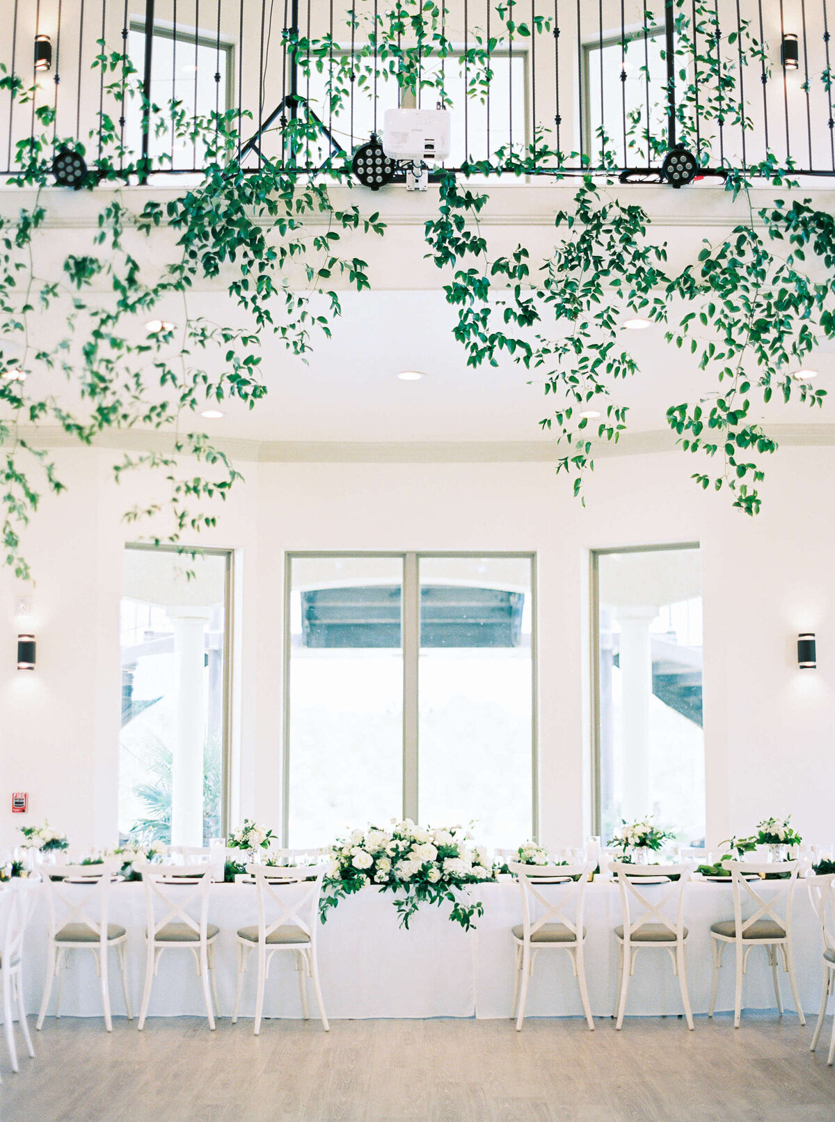 Bridal head table and greenery at D'Vine Grace Vineyard wedding