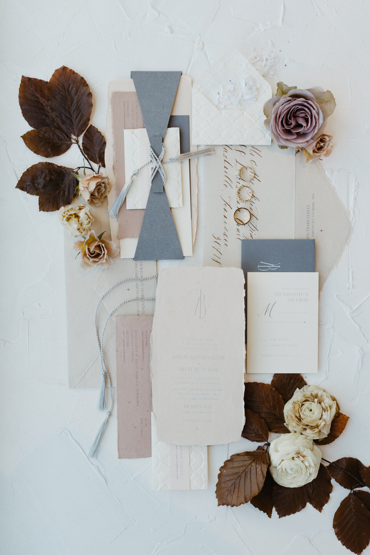 Art deco 1920s, gatsby inspired wedding with hues of terra cotta, dusty pink, mauve, and burgundy. Lush roses, ranunculus, and copper beech highlight the florals. Designed by Rosemary and Finch in Nashville, TN.