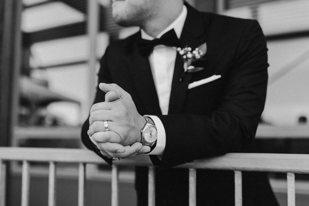 black and white image of groom on his wedding day