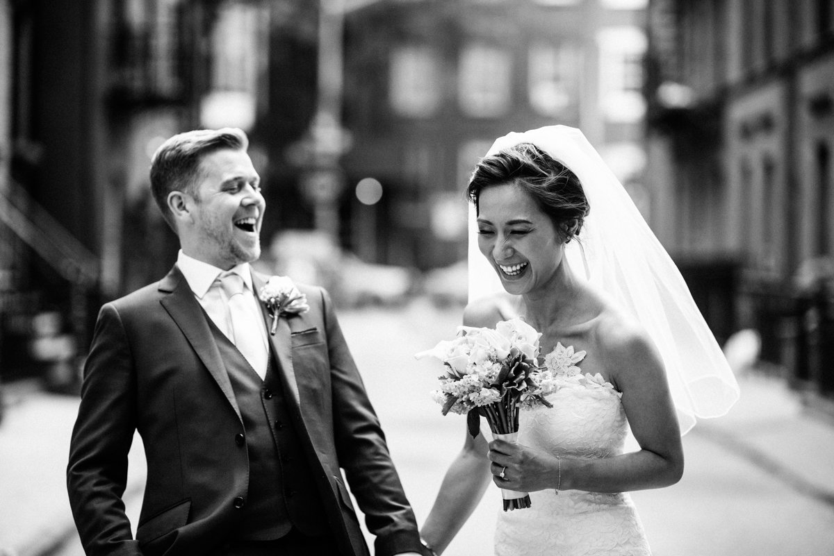 Just married couple laughing in the west village of NYC