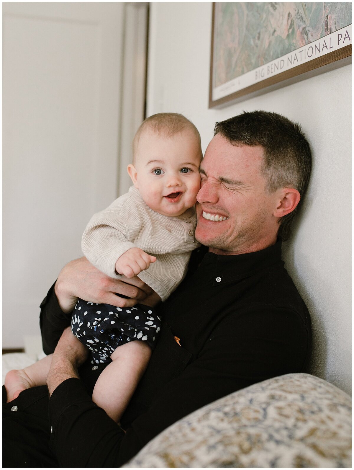 Father squeezing baby to cheek at sweet home family session in Austin by Amber Vickey Photography