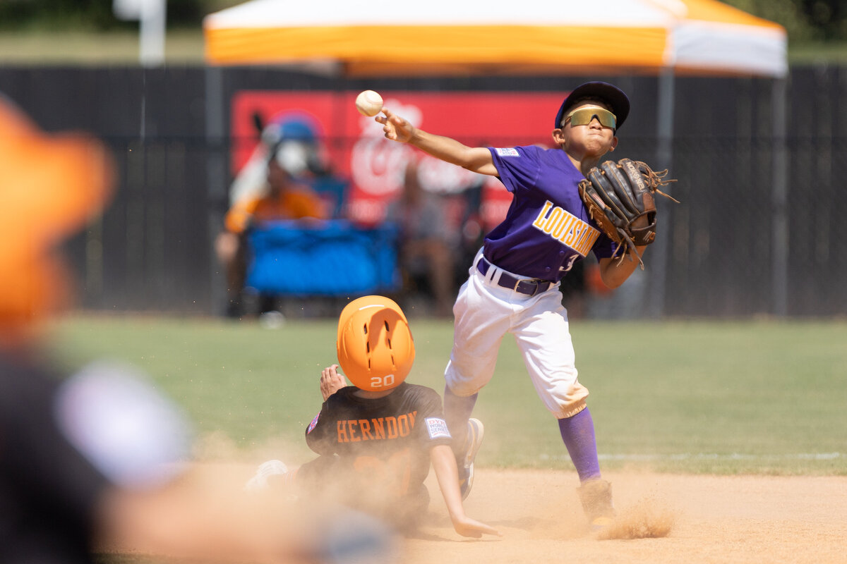 Channing Walker throws to first base against Tennessee in the Dixie Youth League World Series of 2023.