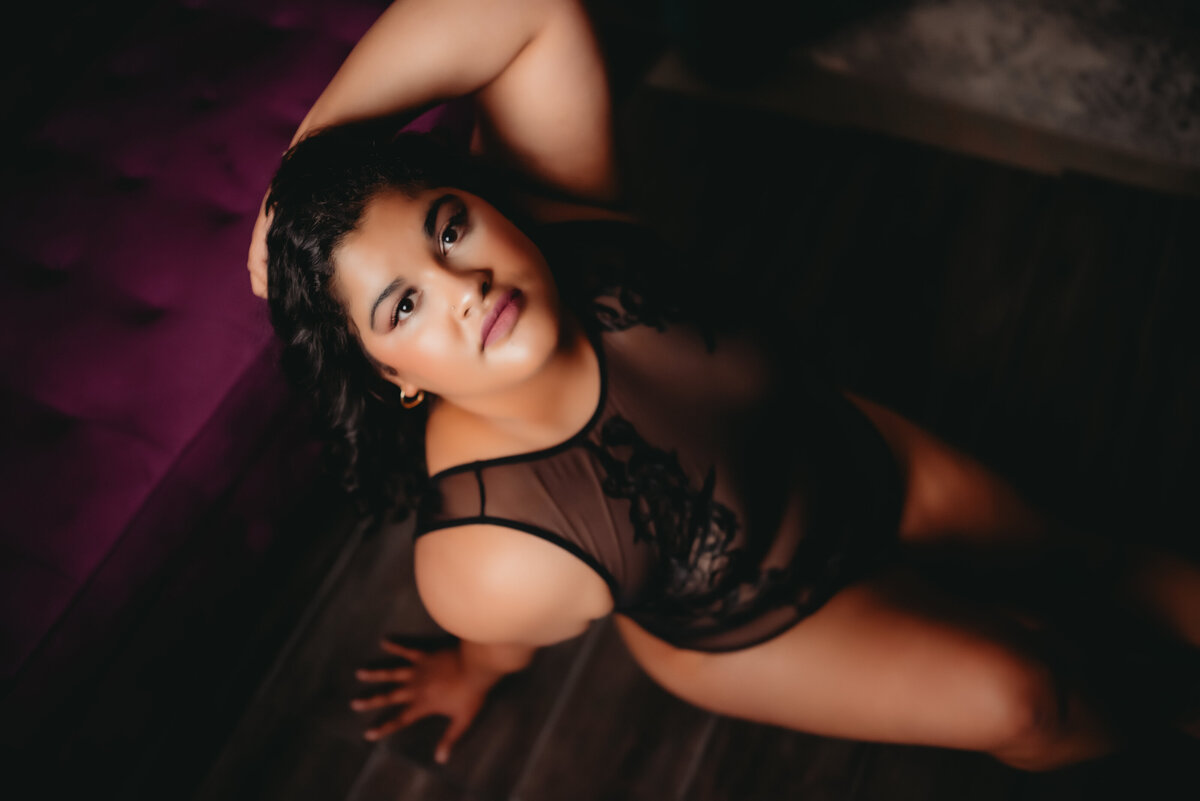 woman in black body suit