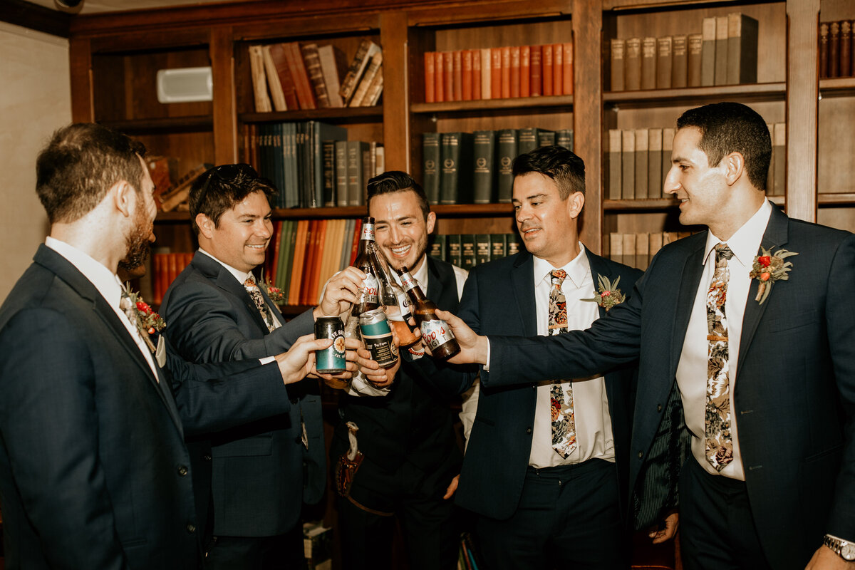 groom having a drink with buddies before wedding ceremony
