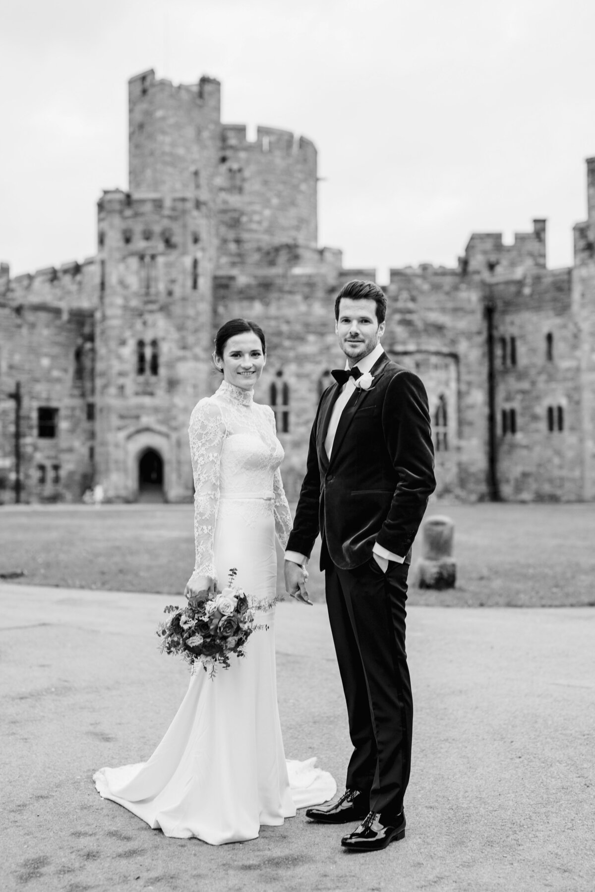 couple stood in front of peckforton castle