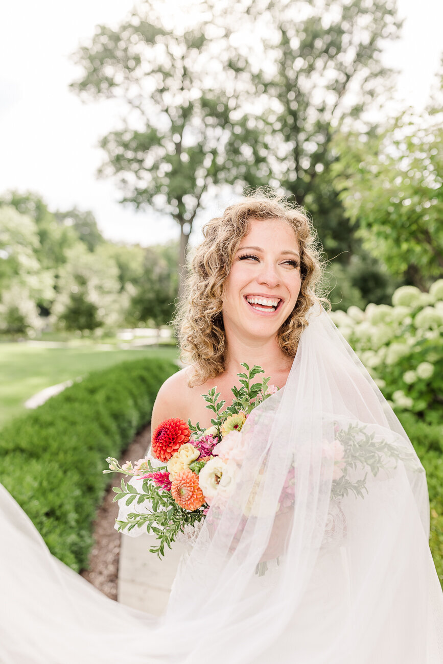 bride laughing while looking to the side