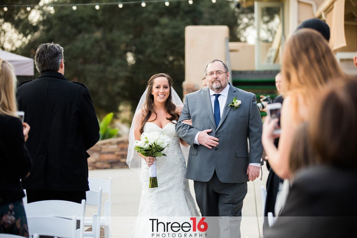 Bride escorted by her father at Boulder Oaks  Golf Wedding  Venue