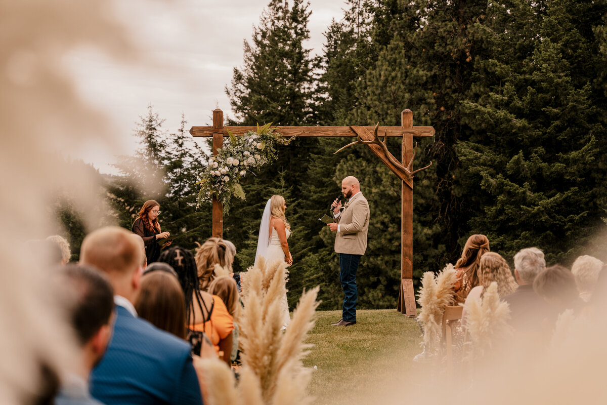 The couple shares their vows during their ceremony at Squilchuck State Park in Wenatchee, Washington.