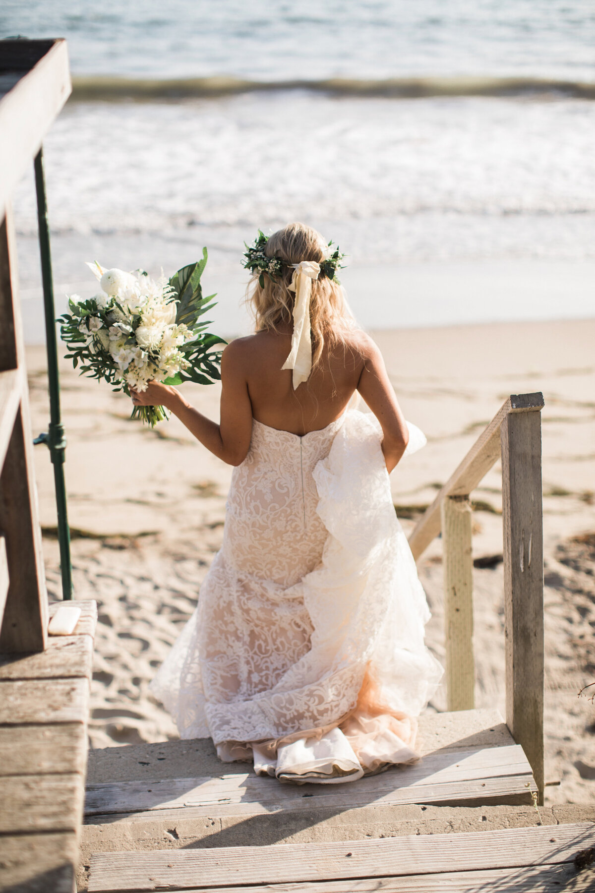 Bride walking down beach at Dos Pueblos Ranch wedding, Santa Barbara, CA
