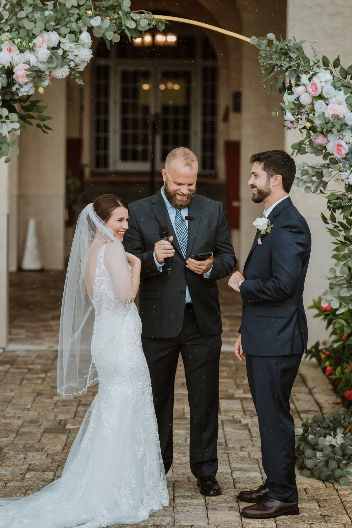 wedding ceremony vows in the rain at the fenway hotel in dunedin florida