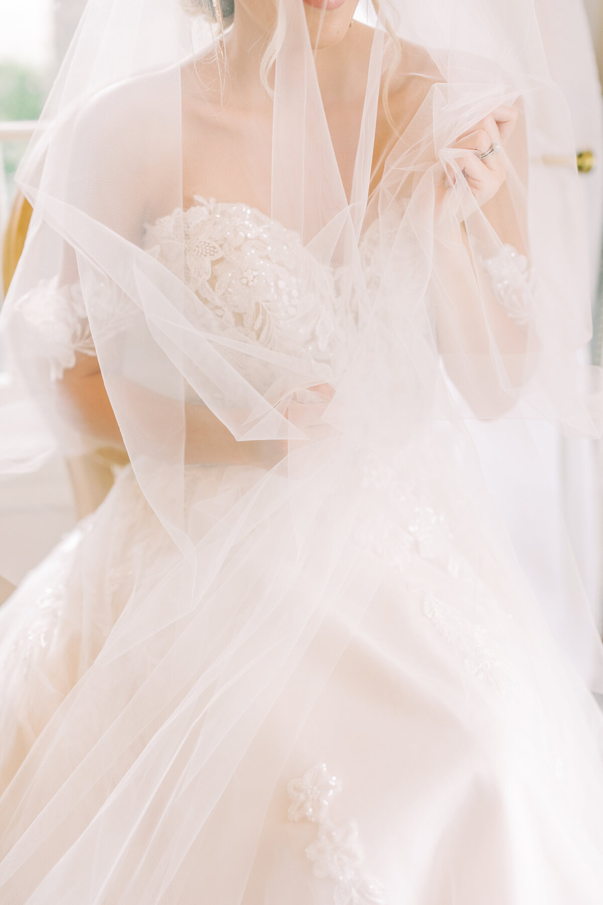 bride holding long veil