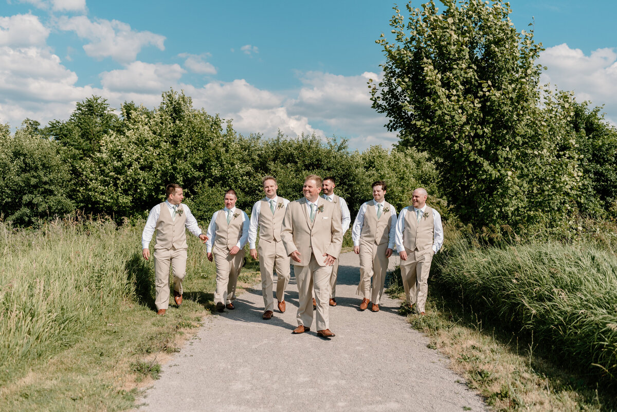 groomsmen walking with groom