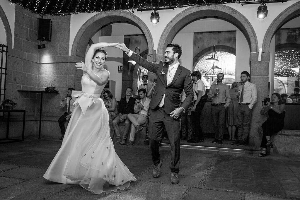 Groom twirls bride on dancefloor during couples first dance at Casa De Monico