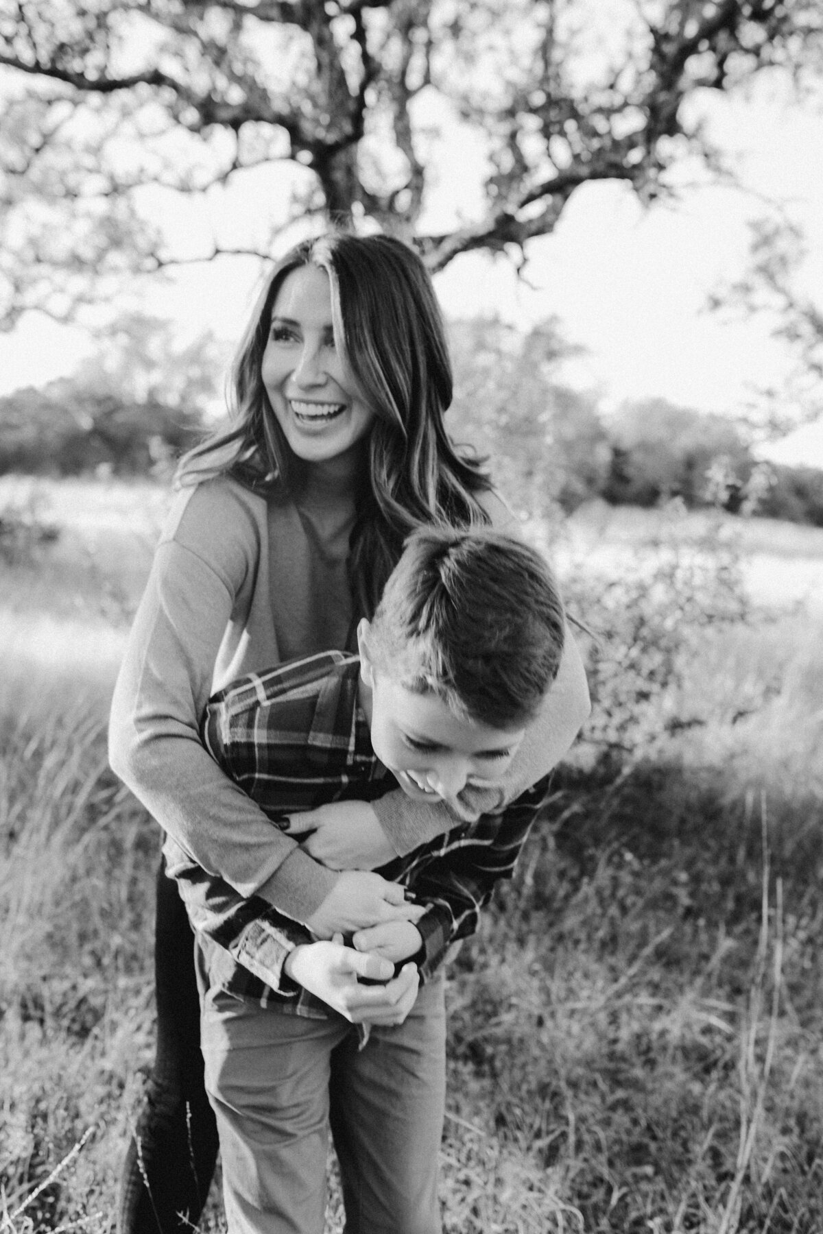 Mother holding boy from behind at at Austin family photo session