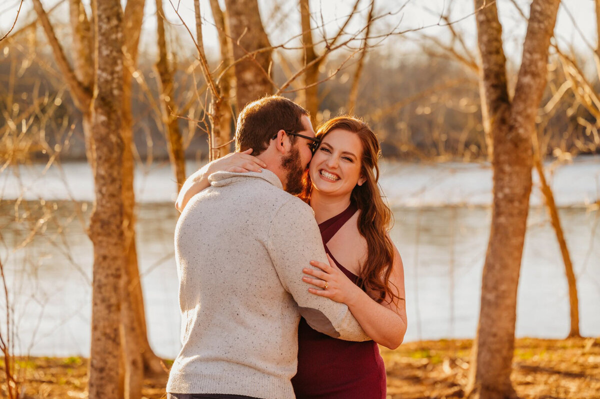 photo of woman laughing with her fiance