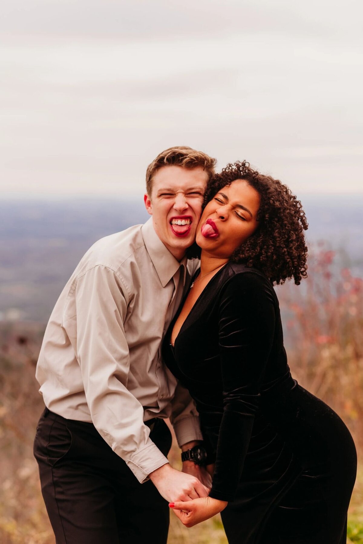 photo of man and woman making silly faces together