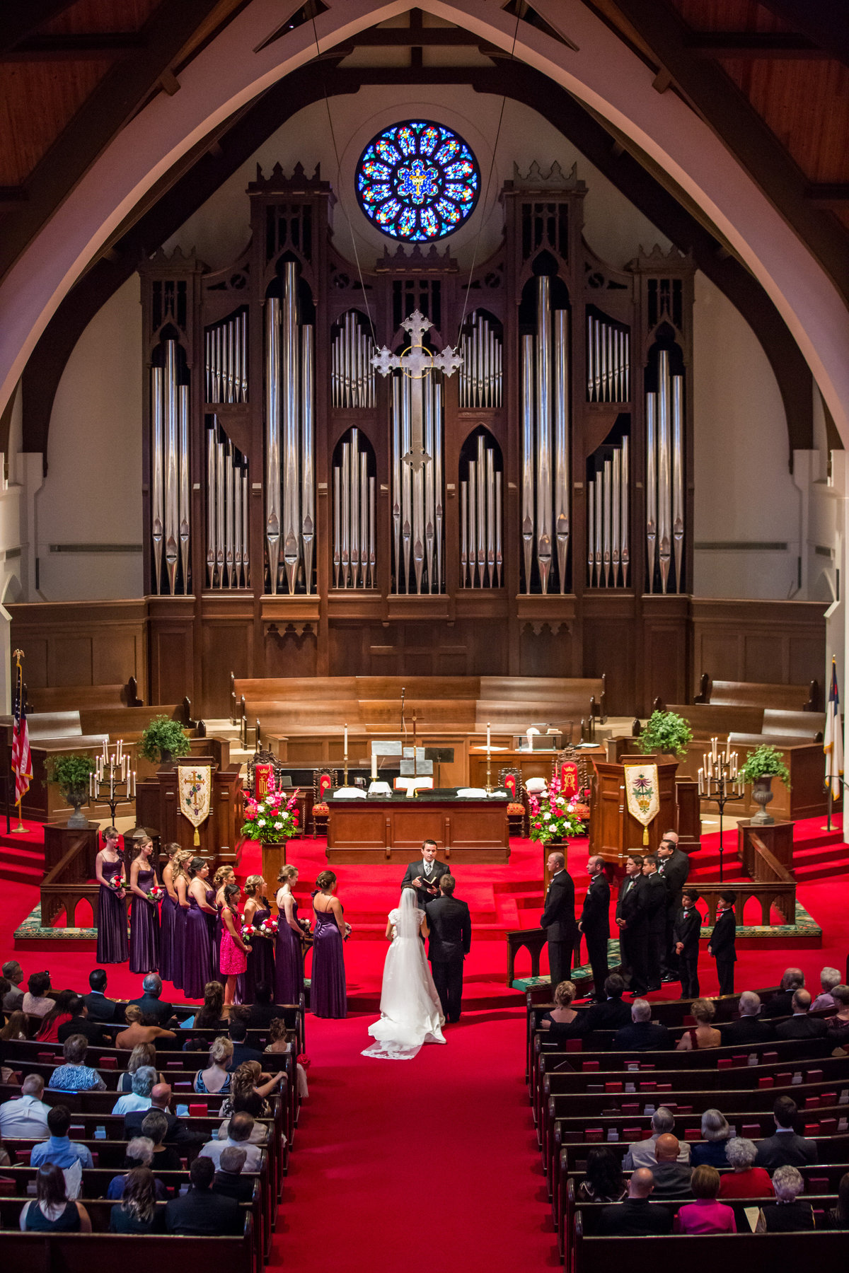 bride groom and bridal party stand at altar during wedding ceremony at Alamo Heights United Methodist Church in San Antonio