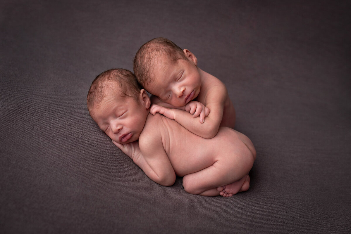 Creative newborn twin portrait captured in Houston