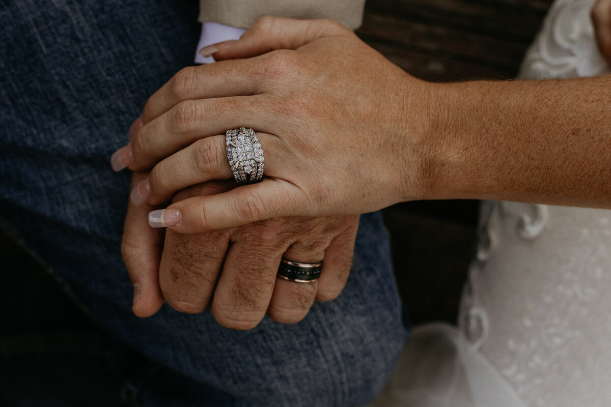 newlyweds hands upclose with their wedding rings