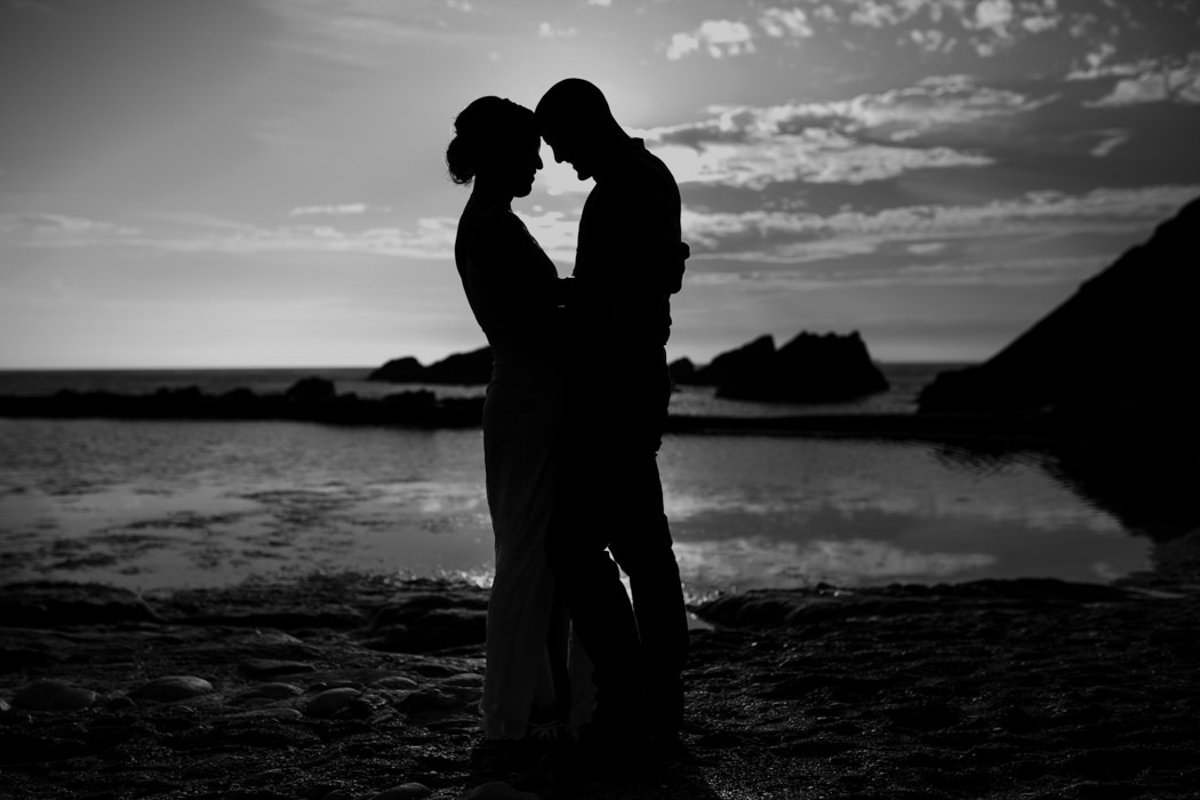 Black and White wedding photo on beach at Tunnels Beaches Devon