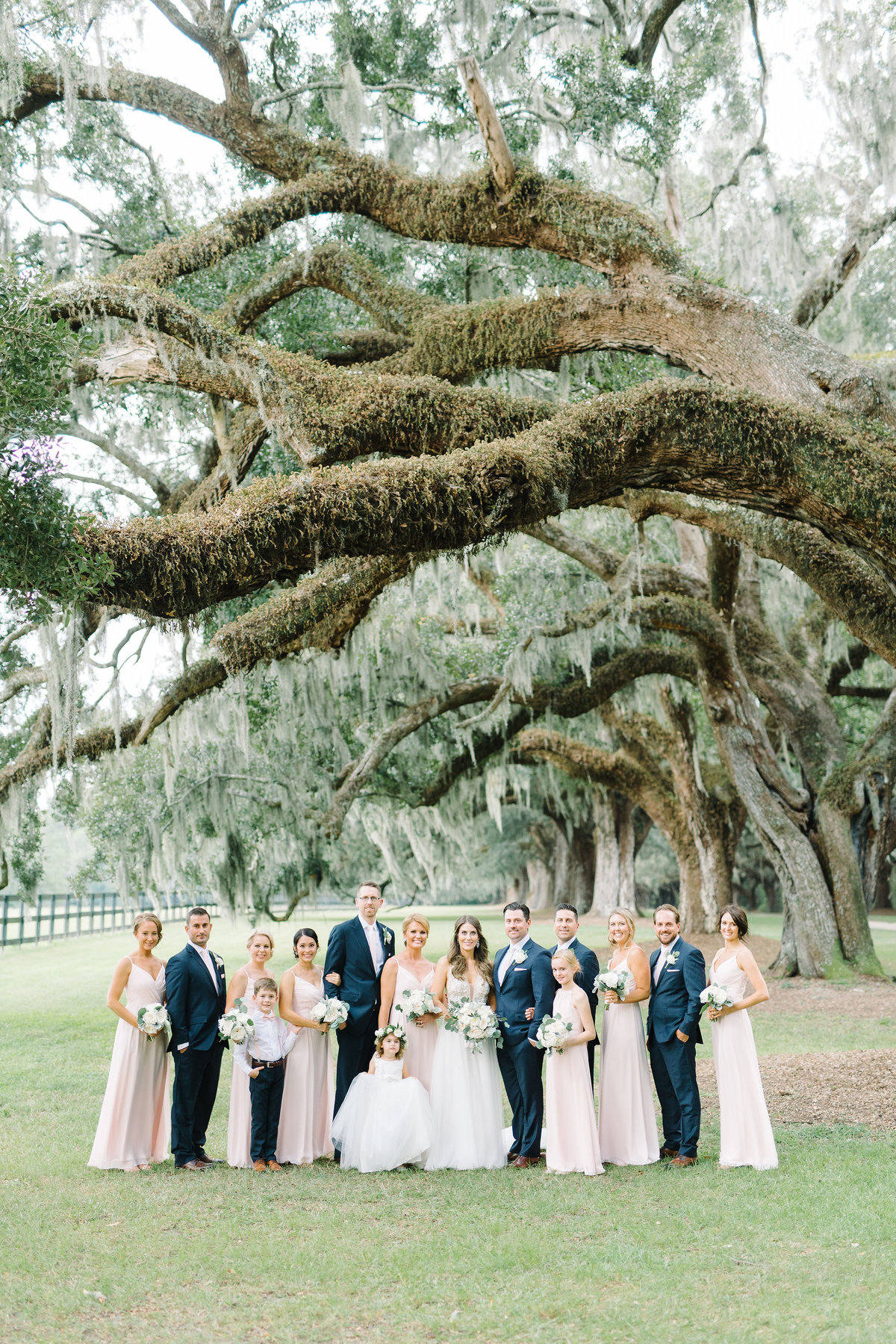 Wedding Party at Boone Hall Plantation Bridesmaids in Blush Pink Dresses and Groomsmen in Navy Blue Suits
