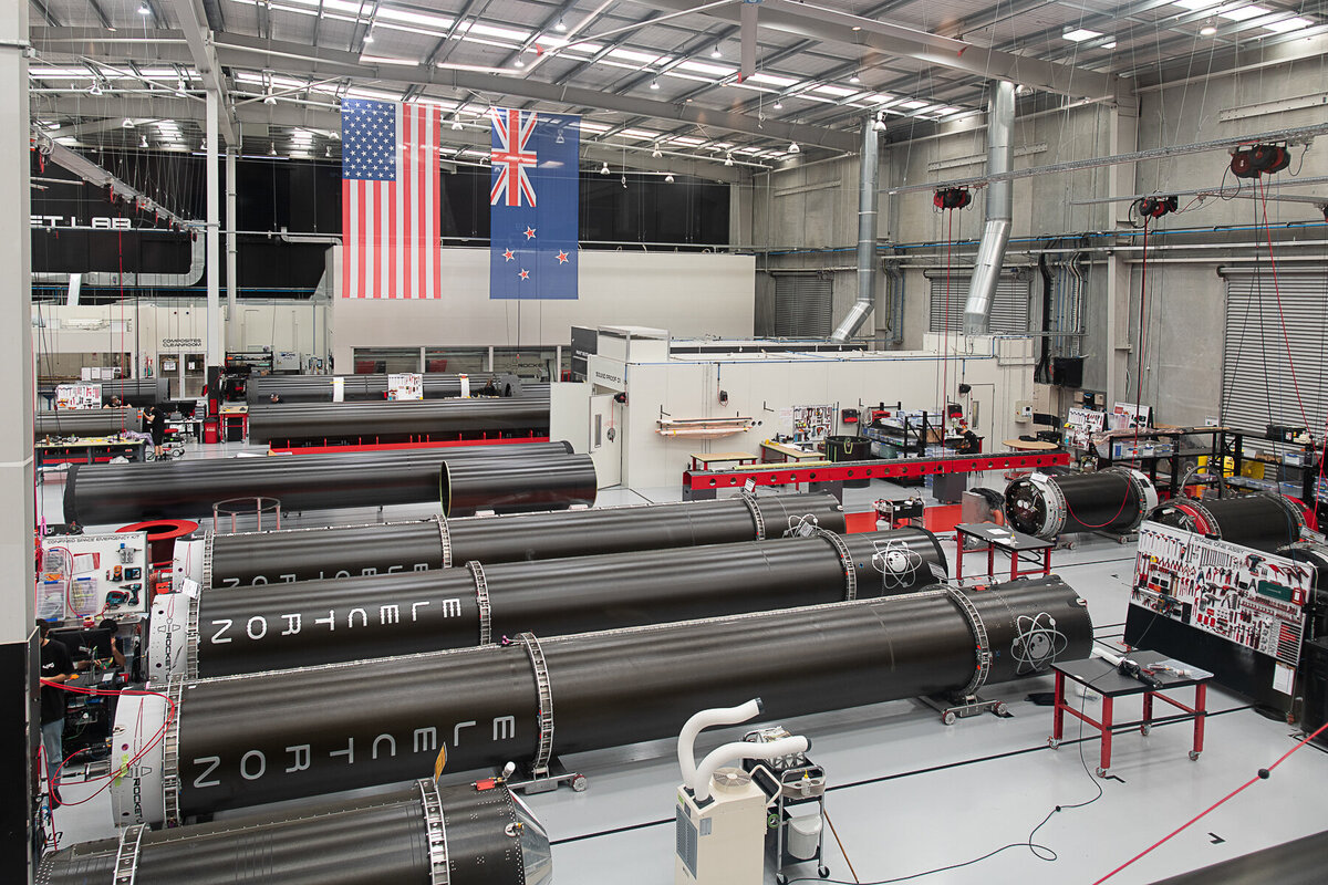 Rocket lab's Auckland Production Centre. Internal wide shot showing multiple electron rockets in production.