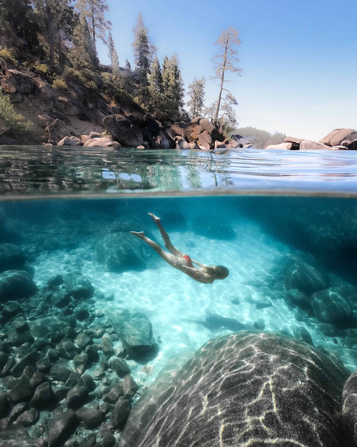 Underwater photo of woman swimming in Lake Tahoe