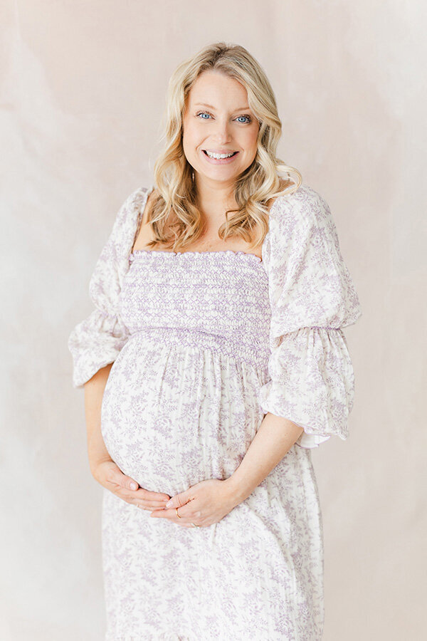 A Northern Virginia Newborn Photographer photo of a pregnant mother in our Warrenton studio