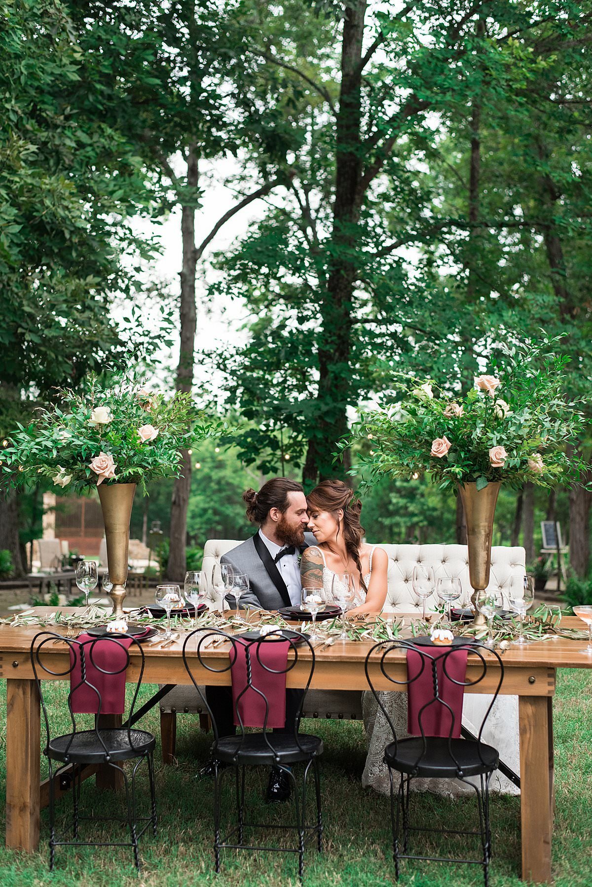 Couple sitting at table outside of venue during their micro wedding reception