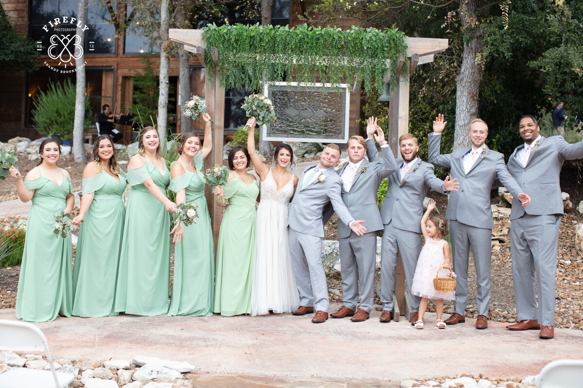 bride and groom cheer with wedding party at Geronimo Oaks wedding