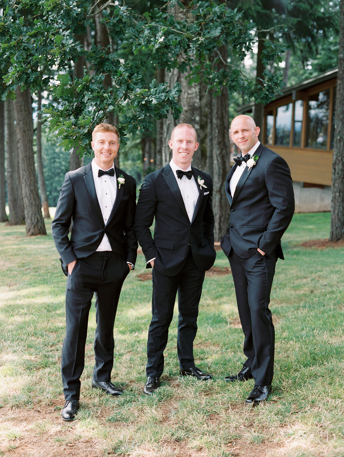 groomsmen standing in front of vista hills tasting room