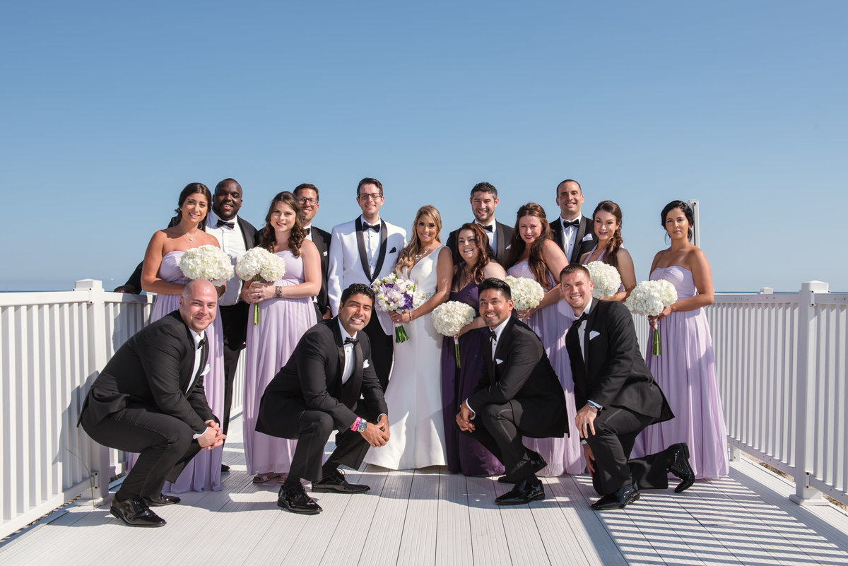 bridal party at the white boardwalk at Oceanbleu