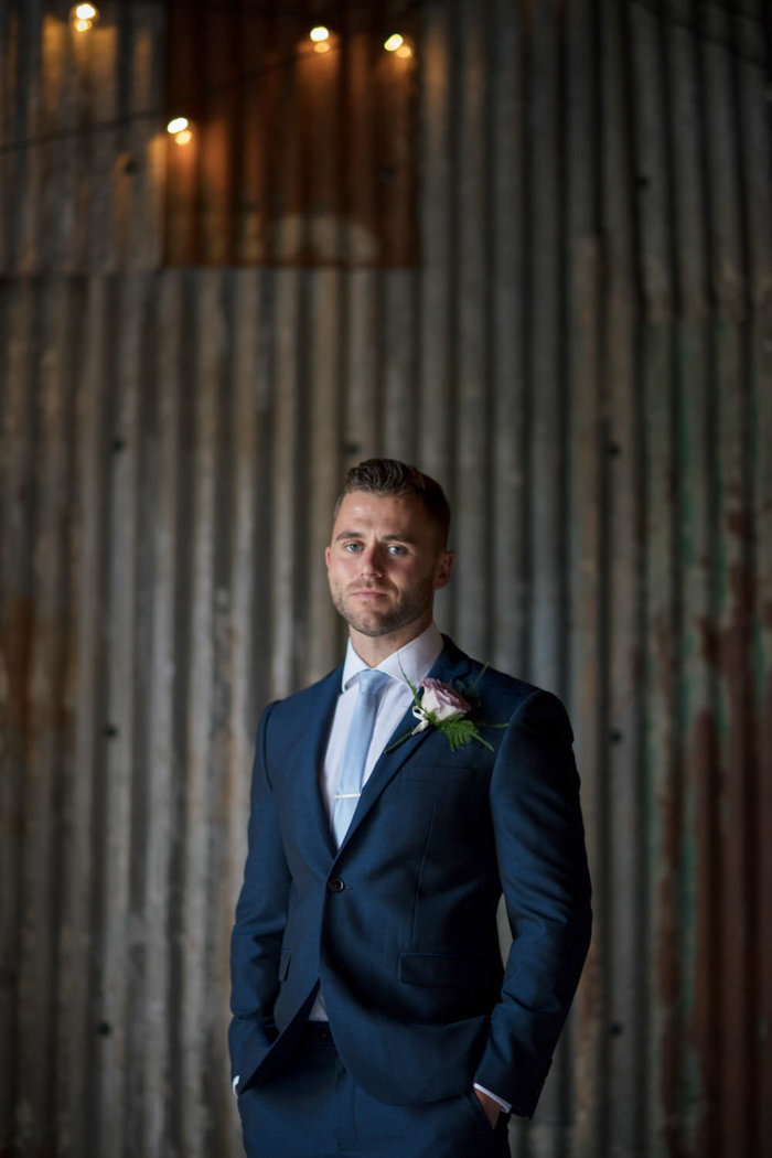 Groom in the rustic barn at The Green Cornwall