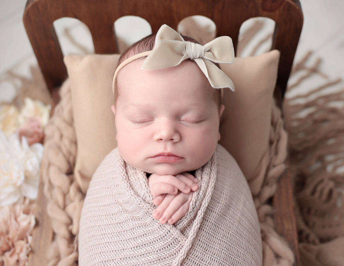 Sleeping baby girl with  a bow