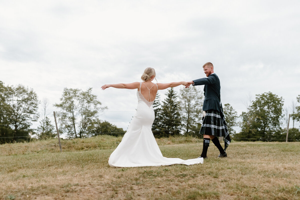the couple dancing out in the field