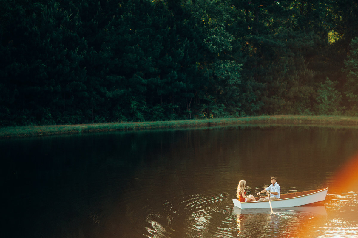 Engagement Photo Of Couple On Rowboat