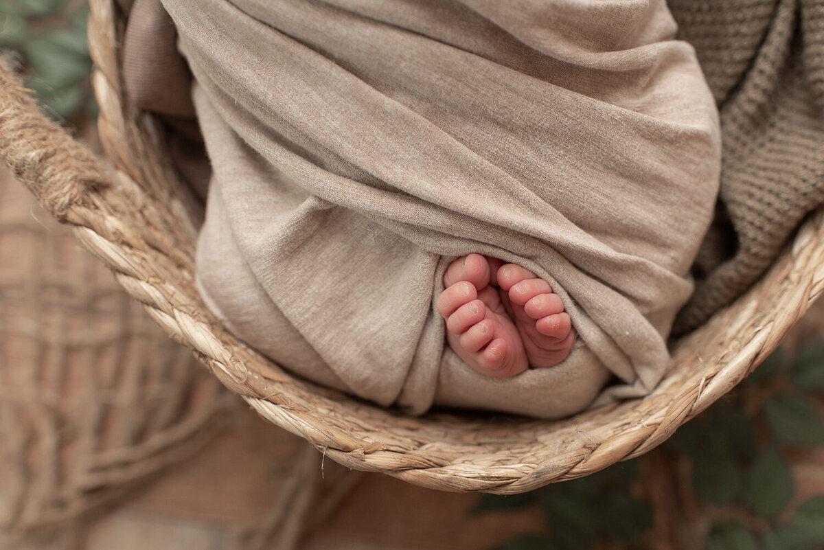 Close up of baby's feet, wrapped in tan wrap | Sharon Leger Photography | CT Newborn & Family Photographer | Canton, Connecticut