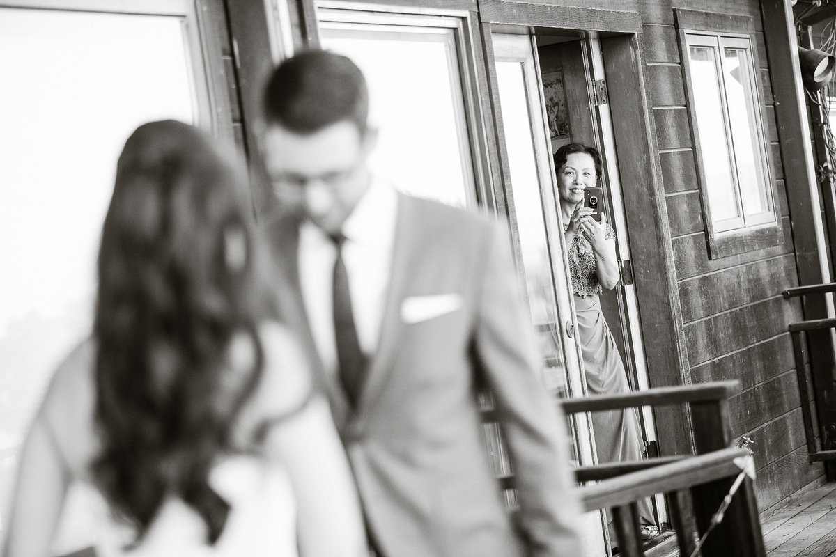 A couple sees each other for their first time at their wedding at Thomas Fogarty Winery.