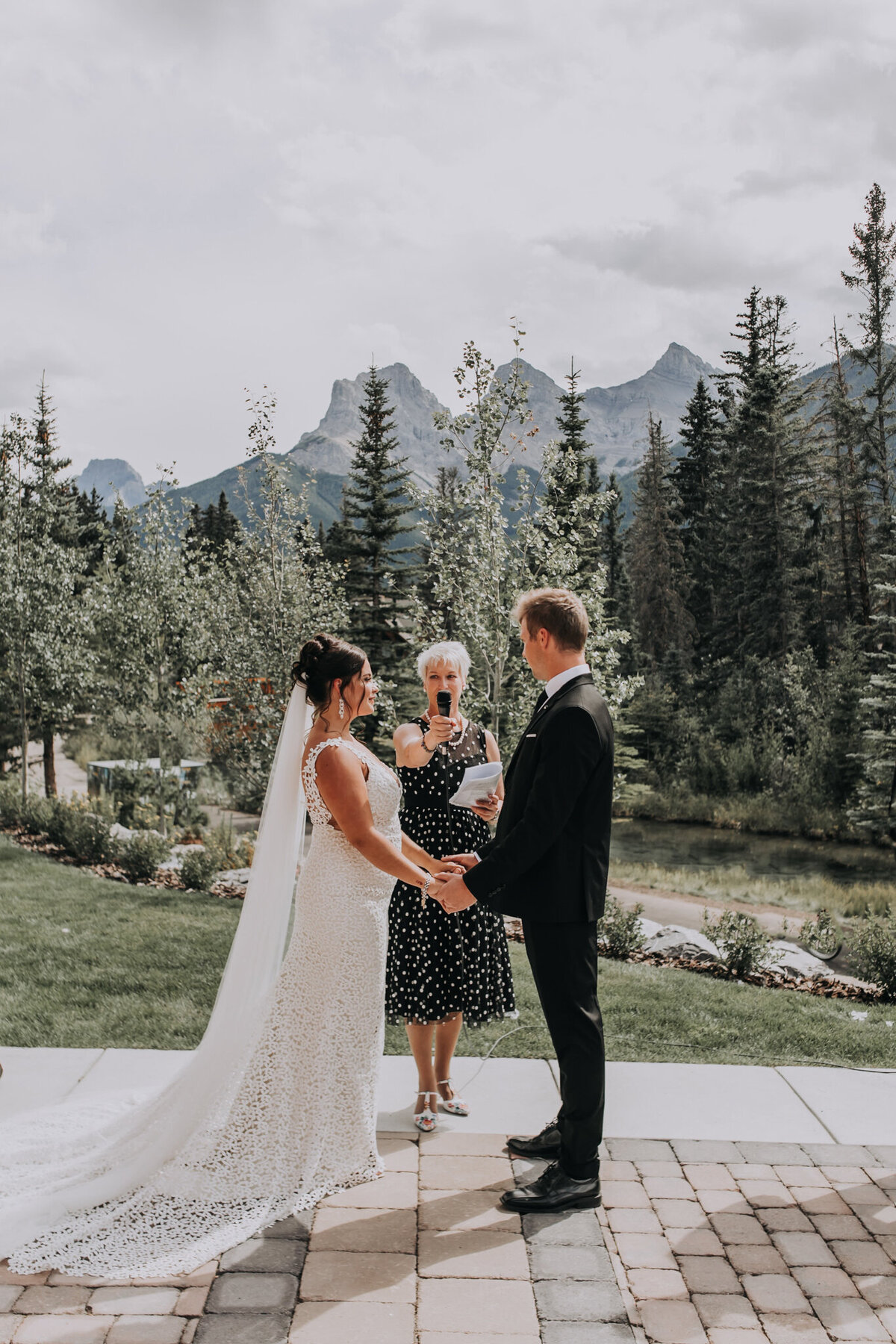 Beautiful outdoor wedding ceremony at The Malcolm Hotel, a modern romantic wedding venue in Canmore, featured on the Brontë Bride Vendor Guide.