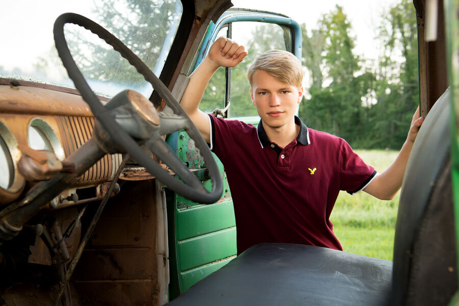 high school senior boy with vintage truck