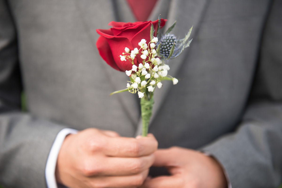 man with flower on wedding day