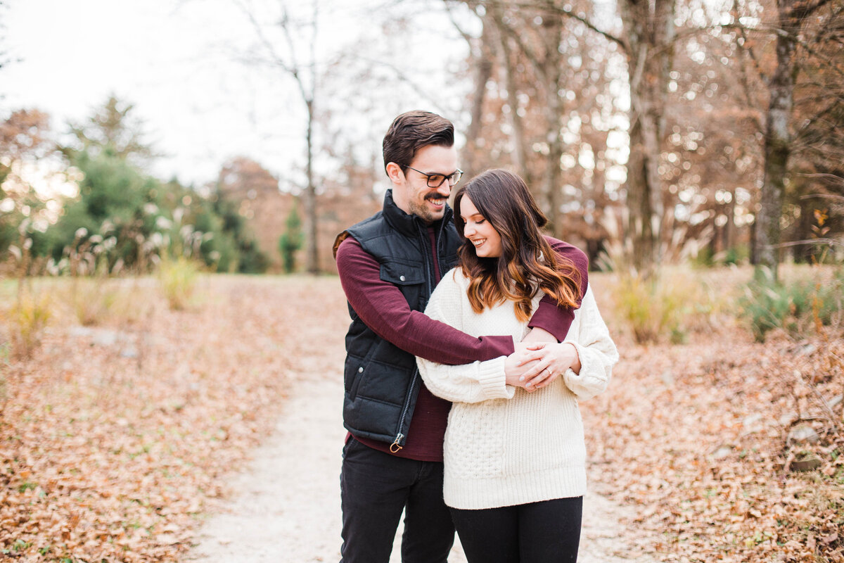 couple walking on trails at Knoxville Botanical Gardens engagement session