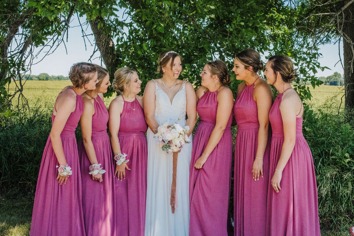 Bride and bridesmaids celebrating a lot of smiles before the ceremony