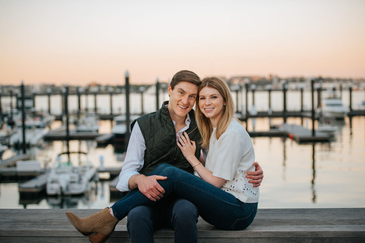 engaged couple seaport district boston harbor boats